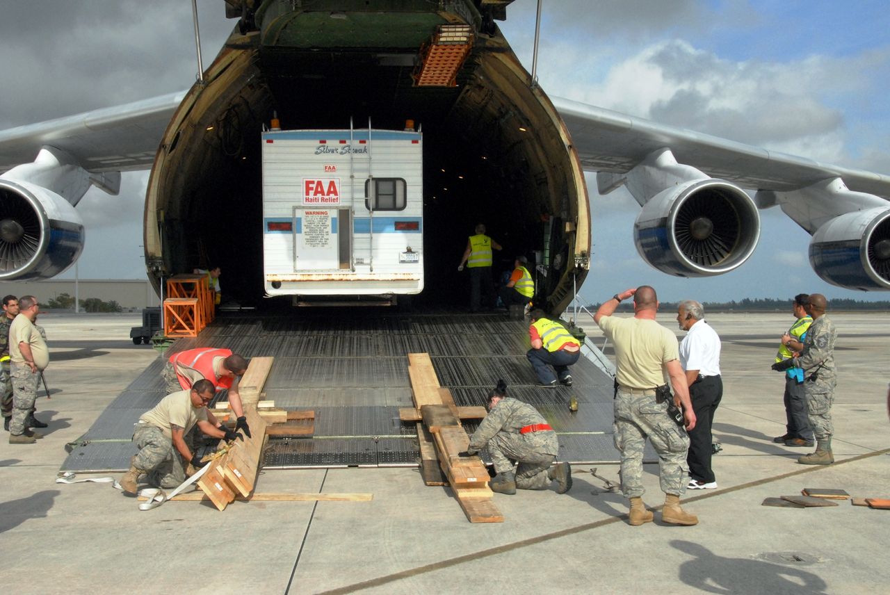 Freight being loaded onto a cargo aircraft ramp