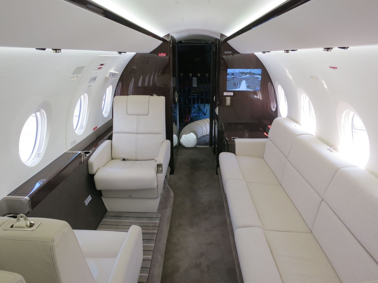 Executive cabin interior with white leather seating